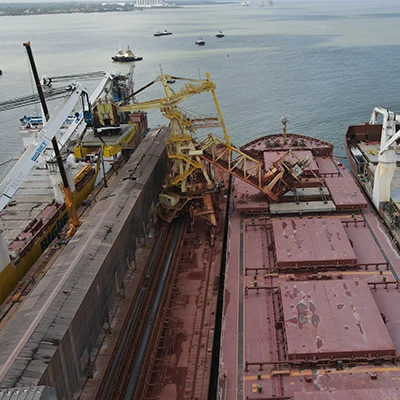 The Tuncare docked between two ships
